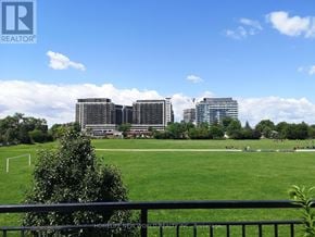 Toronto (Bathurst Manor) townhouse for rent - A park with a soccer field and buildings in the background.