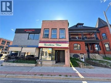 Kitchener apartment for rent - A building with a sign that says "Northern Thai" in front of it.