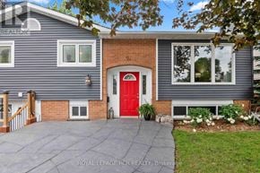 Orangeville apartment for rent - A house with a red door and a grey siding.