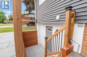 Orangeville apartment for rent - A wooden gate with a brick wall and a white door.