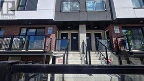St. Catharines (E. Chester) townhouse for rent - A building with a sign that says "REALTOR" on it.
