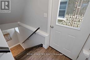 Southgate apartment for rent - A white door with a window above it and a wooden floor.