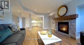 Southgate apartment for rent - A living room with a fireplace and a couch.