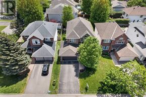 Ottawa apartment for rent - A bird's eye view of a residential neighborhood with houses and cars.
