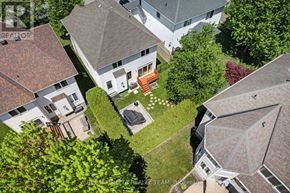 Ottawa apartment for rent - A bird's eye view of a residential area with houses and green lawns.
