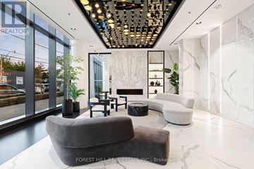 Toronto (Dovercourt-Wallace Emerson-Junction) condo for rent - A modern living room with a grey sofa and a marble floor.