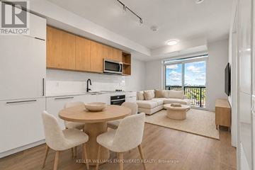 Toronto (Dovercourt-Wallace Emerson-Junction) condo for rent - A modern kitchen with a dining table and chairs.