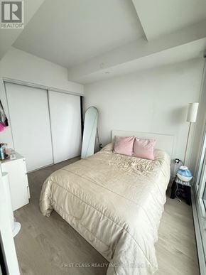 Mississauga (City Centre) condo for rent - A bedroom with a bed, a nightstand, and a window with blinds.
