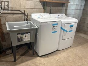 West Lincoln apartment for rent - A washing machine and a sink are in a room.