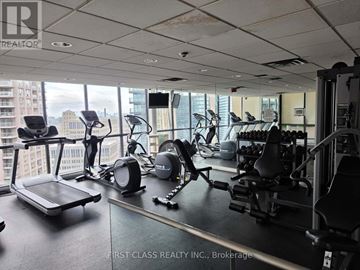 Toronto (Bay Street Corridor) condo for rent - A gym with treadmills, weights and exercise machines.