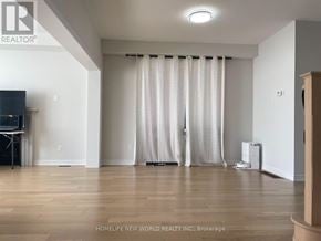 Georgina (Sutton & Jackson's Point) apartment for rent - A spacious room with a large window covered by a white curtain.
