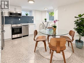 Toronto (High Park North) apartment for rent - A modern kitchen with a glass table and chairs.