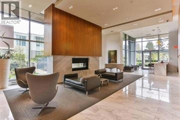 Burnaby apartment for rent - A living room with a brown sofa and a wooden cabinet.