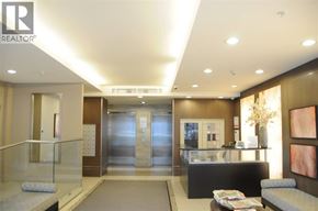 Vancouver apartment for rent - A reception area with a glass counter and a couch.