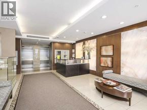 Vancouver apartment for rent - A reception area with a desk and a couch.