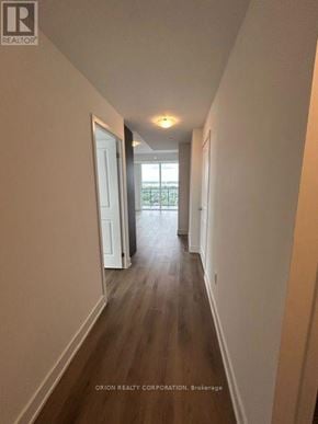 Milton (Om Old Milton) condo for rent - A long hallway with a door at the end.