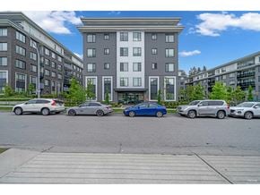 Surrey apartment for rent - A parking lot with cars and a building in the background.