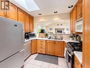 North Vancouver apartment for rent - A kitchen with wooden cabinets and a refrigerator.
