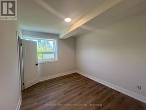Toronto (Mimico) condo for rent - A room with wooden flooring and a window letting in natural light.