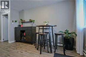 Cambridge townhouse for rent - A living room with a fireplace and bar stools.