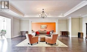 King (King City) condo for rent - A living room with a couch, chairs, and a rug.
