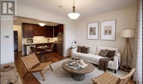 King (King City) condo for rent - A living room with a white couch and a coffee table.