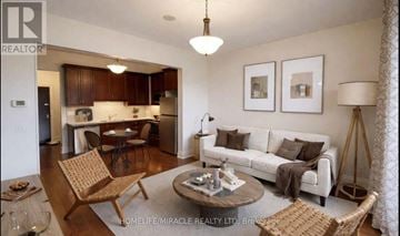 King (King City) condo for rent - A living room with a white couch and a coffee table.