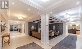 King (King City) condo for rent - A spacious living room with a high ceiling and a large rug on the floor.