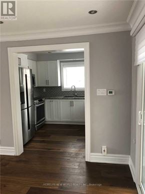 Richmond Hill (Crosby) apartment for rent - A kitchen with wooden floors and white walls.