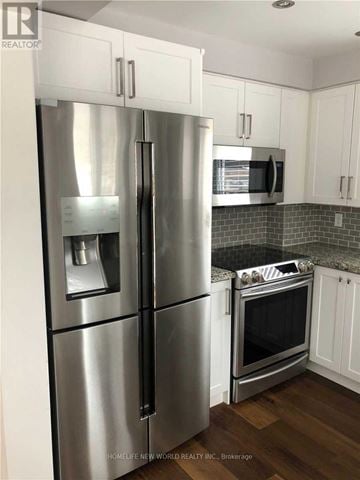 Richmond Hill (Crosby) apartment for rent - A stainless steel refrigerator and oven in a kitchen.
