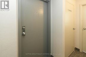 Oakville (Ga Glen Abbey) condo for rent - A hallway with a door on the left and a door on the right.