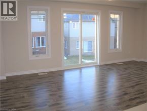 Kitchener townhouse for rent - A room with a REALTOR® logo on the wall.