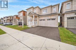 Oakville (Go Glenorchy) apartment for rent - A row of houses with a car parked in front of the first one.