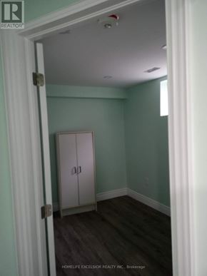 Toronto (Woburn) apartment for rent - A room with a white door and a white cabinet in it.