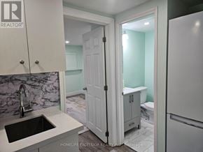 Toronto (Woburn) apartment for rent - A bathroom with a sink and a toilet is shown.