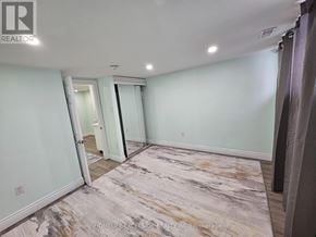 Toronto (Woburn) apartment for rent - A room with a marble floor and a sliding glass door.