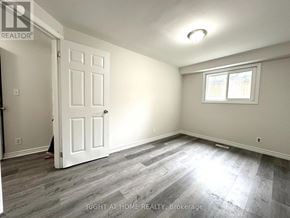 Oshawa (Eastdale) apartment for rent - A room with a white door and a window with a white frame.