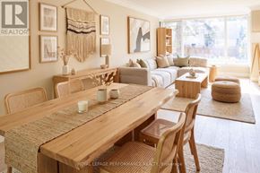 Ottawa apartment for rent - A well-lit, modern dining room with a wooden table and chairs.
