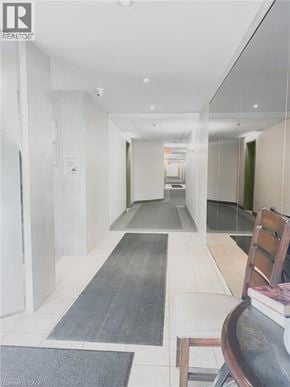 Waterloo apartment for rent - A hallway with a chair and a rug.
