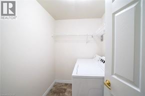Waterloo apartment for rent - A small white bathroom with a toilet and a door.