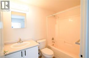 Waterloo apartment for rent - A bathroom with a sink, toilet, and bathtub.