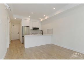 Surrey apartment for rent - A spacious kitchen with a refrigerator, microwave, and oven.