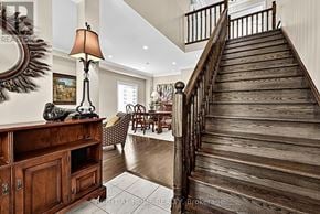 Oro-Medonte (Horseshoe Valley) apartment for rent - A wooden staircase leads up to a brightly lit room.