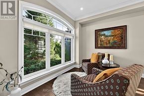 Oro-Medonte (Horseshoe Valley) apartment for rent - A living room with a couch, a table, a vase, and a painting on the wall.