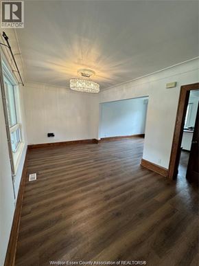 Windsor apartment for rent - A room with wooden flooring and a chandelier hanging from the ceiling.