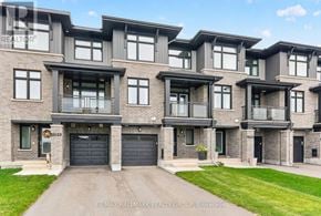 Ottawa townhouse for rent - A large, modern building with a sign that reads RE/MAX Hallmark Realty Group, Brokerage.