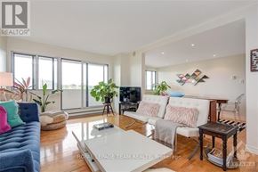 Ottawa condo for rent - A living room with a couch, a chair, a coffee table, and a TV.