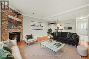 Ottawa townhouse for rent - A living room with a fireplace and a couch.