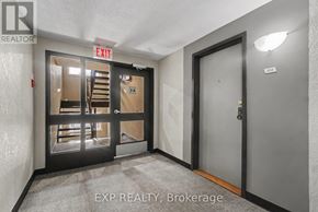 Ottawa condo for rent - A room with a door and a window with a sign that says EXIT.