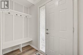 Ottawa townhouse for rent - A white door with a glass panel is in a room with white walls.
